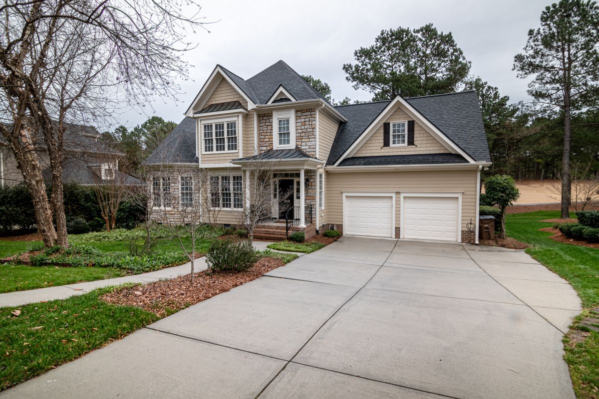 Upscale two-storey home with a white double garage door in Kanata, Ottawa