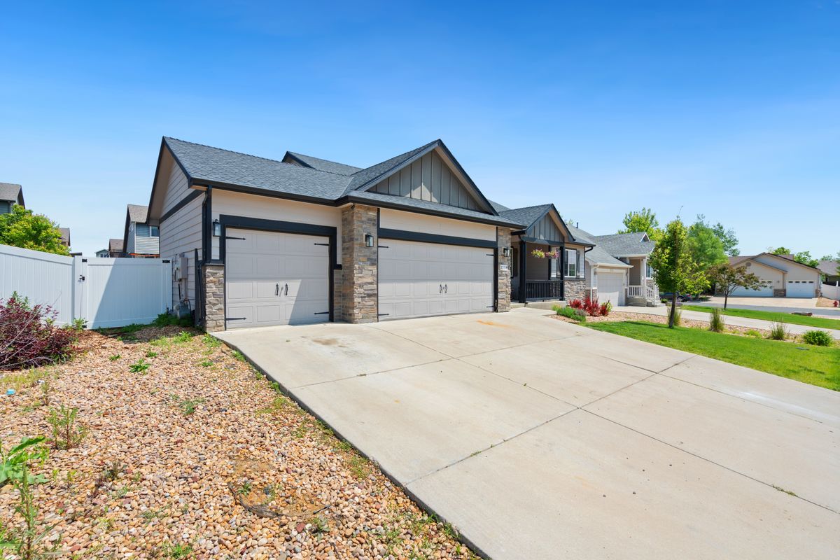 Ottawa home with newer double garage doors and stone accents